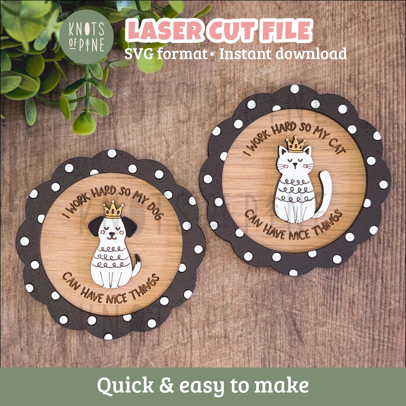 Two circular laser-cut wooden signs with scalloped dark brown edges and white polka dots, each featuring a white cat illustration wearing a gold crown and the text 'I WORK HARD SO MY CAT CAN HAVE NICE THINGS' or 'I WORK HARD SO MY DOGS CAN HAVE NICE THINGS.' The signs are displayed on a rustic wood background with green leaves in the corner.